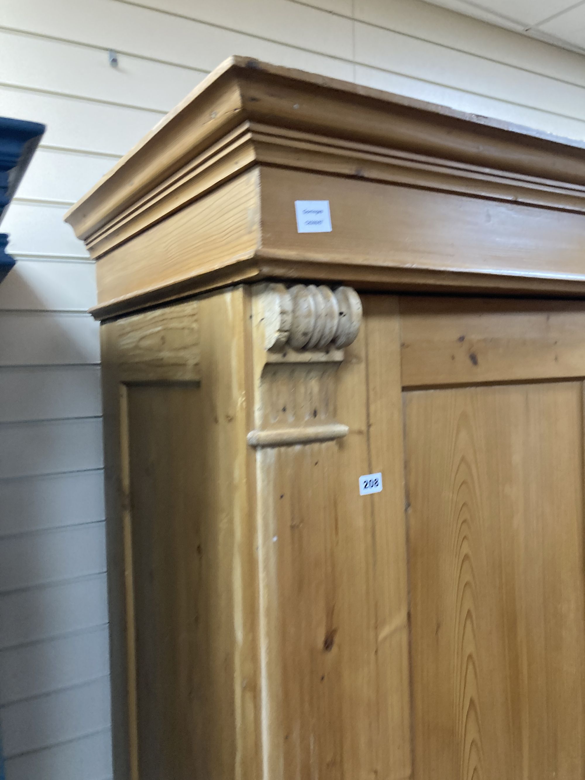 A 19th century East European pine armoire, width 150cm depth 66cm height 203cm